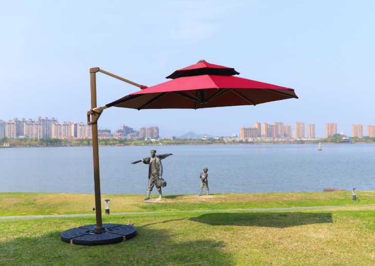 Outdoor umbrella with LED lighting and valance fringing in a Dubai resort setting